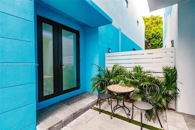 a backyard with table and a chairs