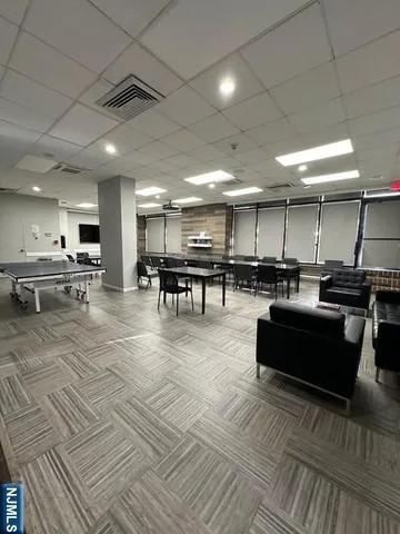 a room with lots of furniture and a rug