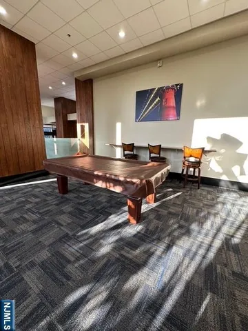 a kitchen with wooden cabinets and a stove