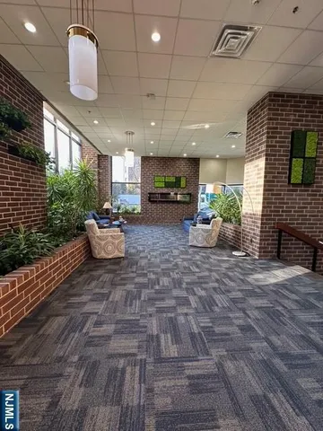 a view of a room window and hall way