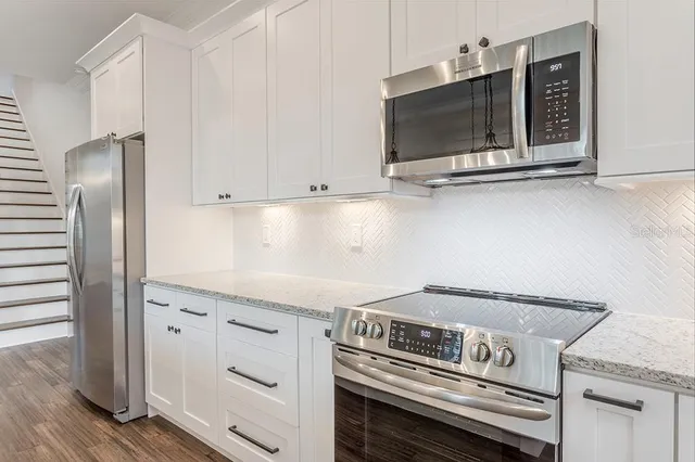 a kitchen with a stove and a microwave