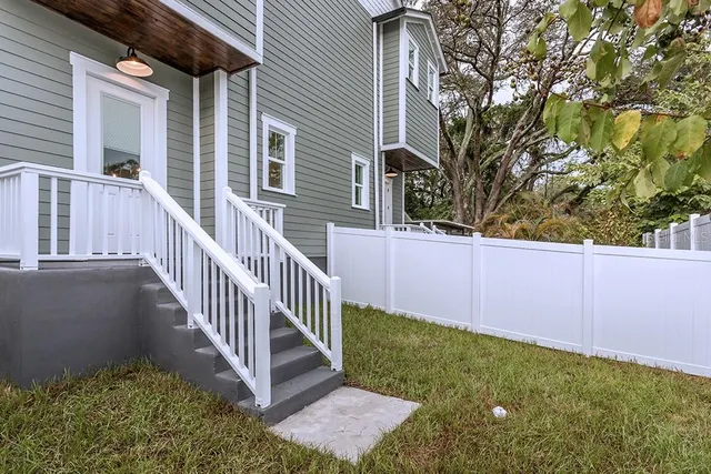 a view of a wrought iron fences in front of house