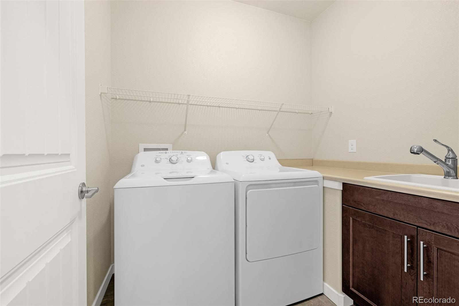 2052 Ruffino Drive Colorado Springs, CO 80921 - Photo 21 of 36 a utility room with dryer and washer