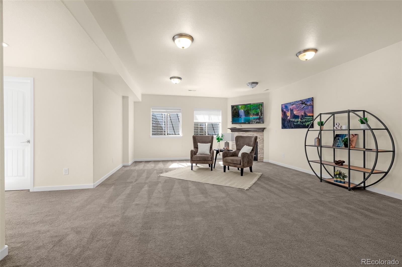 2052 Ruffino Drive Colorado Springs, CO 80921 - Photo 23 of 36 a view of livingroom with furniture and white walls
