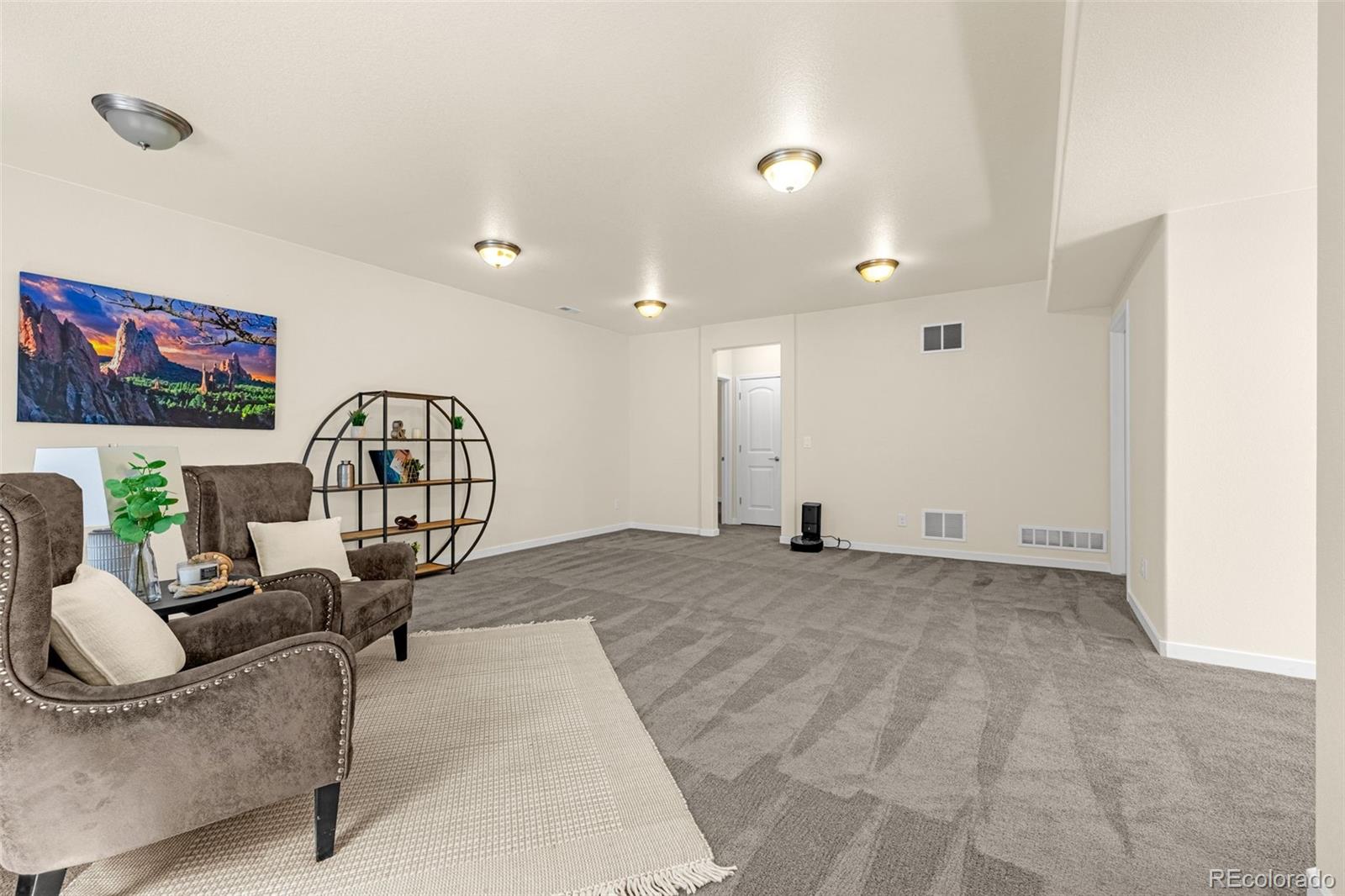 2052 Ruffino Drive Colorado Springs, CO 80921 - Photo 24 of 36 a view of a livingroom with furniture and staircase