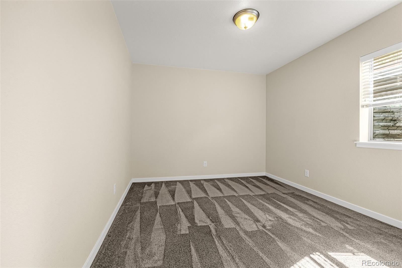 2052 Ruffino Drive Colorado Springs, CO 80921 - Photo 27 of 36 a view of a room with a window