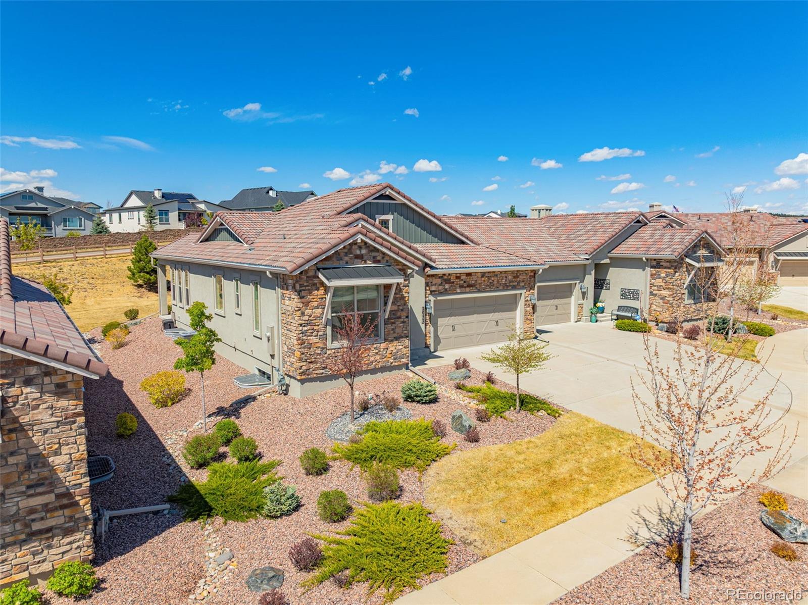 2052 Ruffino Drive Colorado Springs, CO 80921 - Photo 33 of 36 a front view of a house with a yard