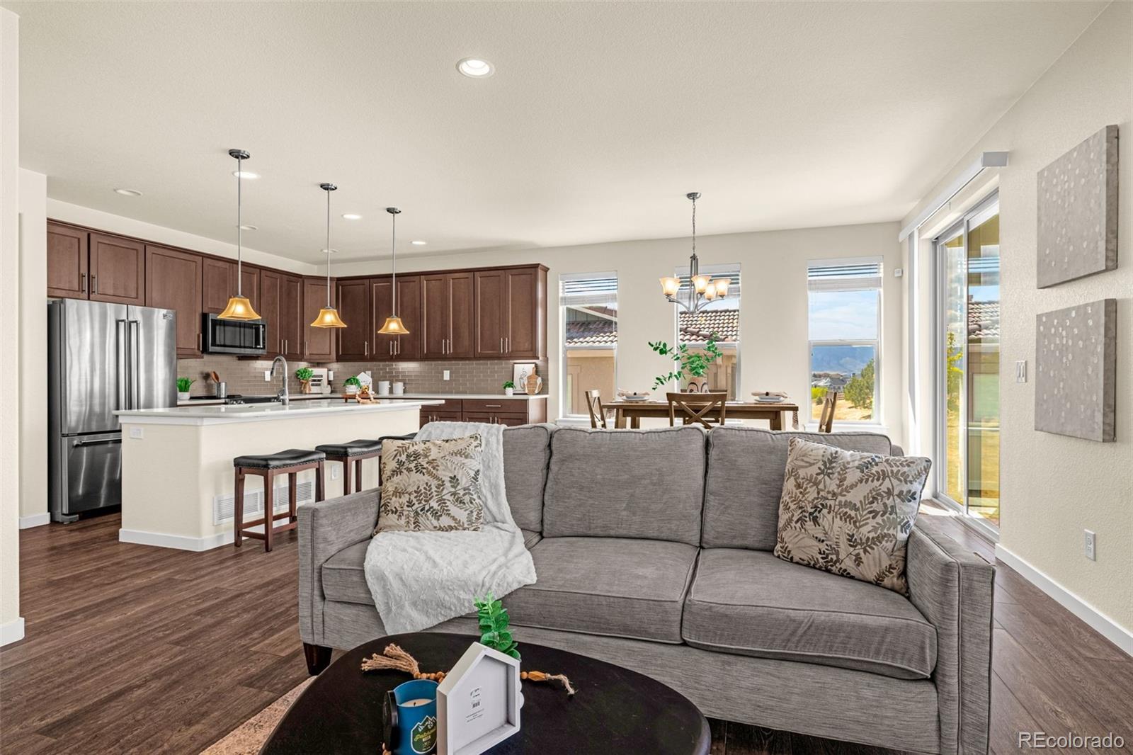 2052 Ruffino Drive Colorado Springs, CO 80921 - Photo 9 of 36 a living room with furniture and kitchen view