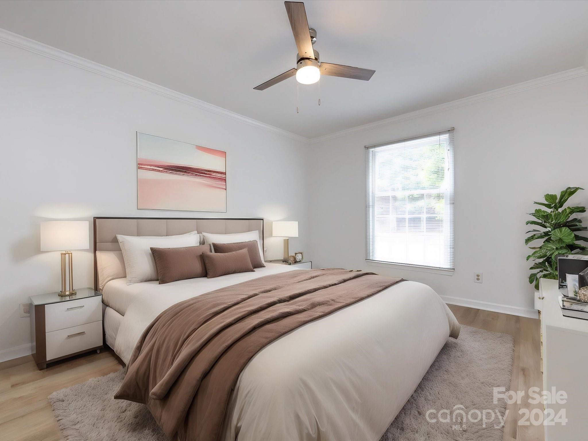 430 Queens Road, Unit 112 Charlotte, NC 28207 - Photo 11 of 19 a bedroom with a large bed and a chandelier