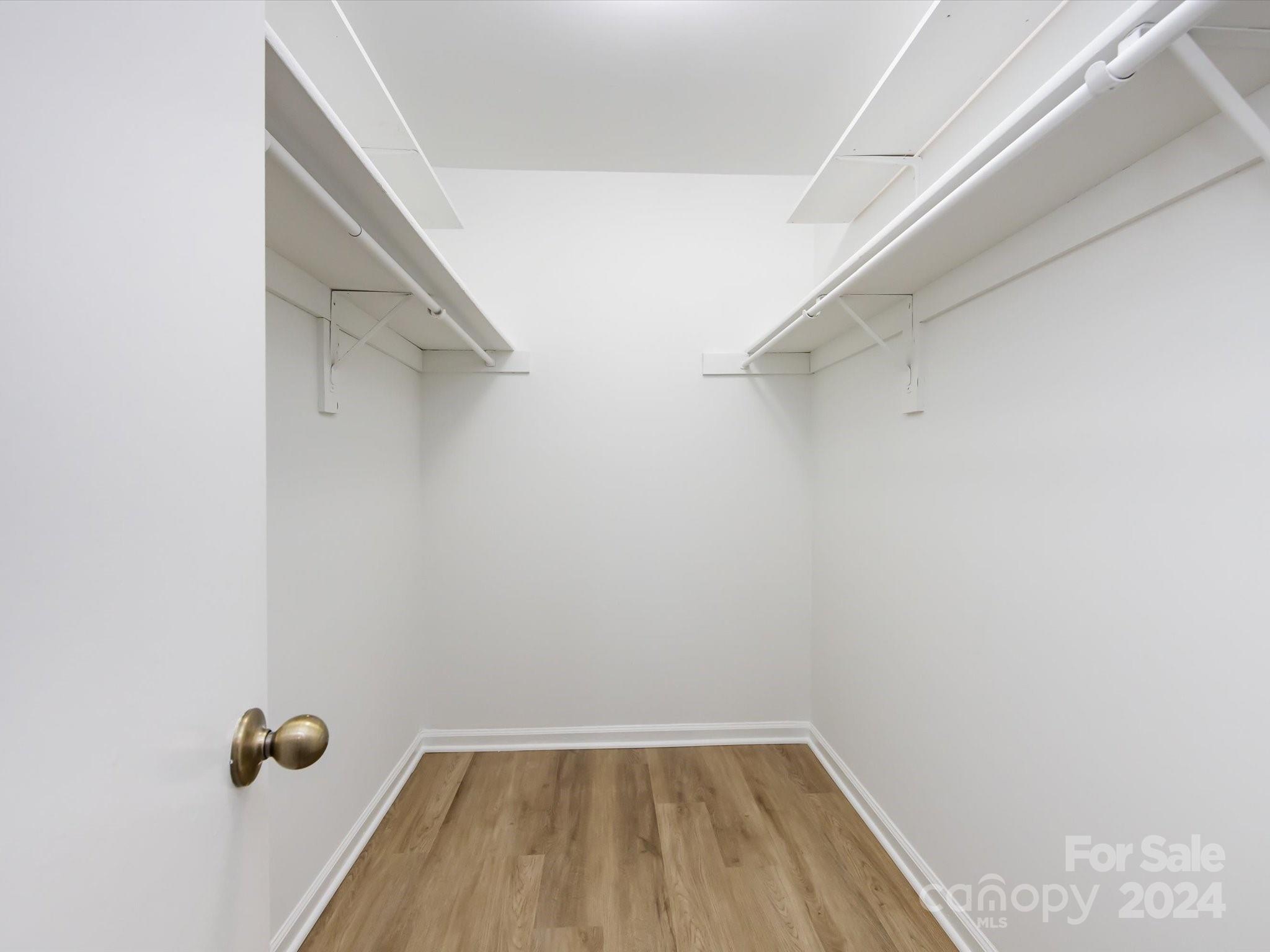 430 Queens Road, Unit 112 Charlotte, NC 28207 - Photo 13 of 19 a view of a room with rack on the wall