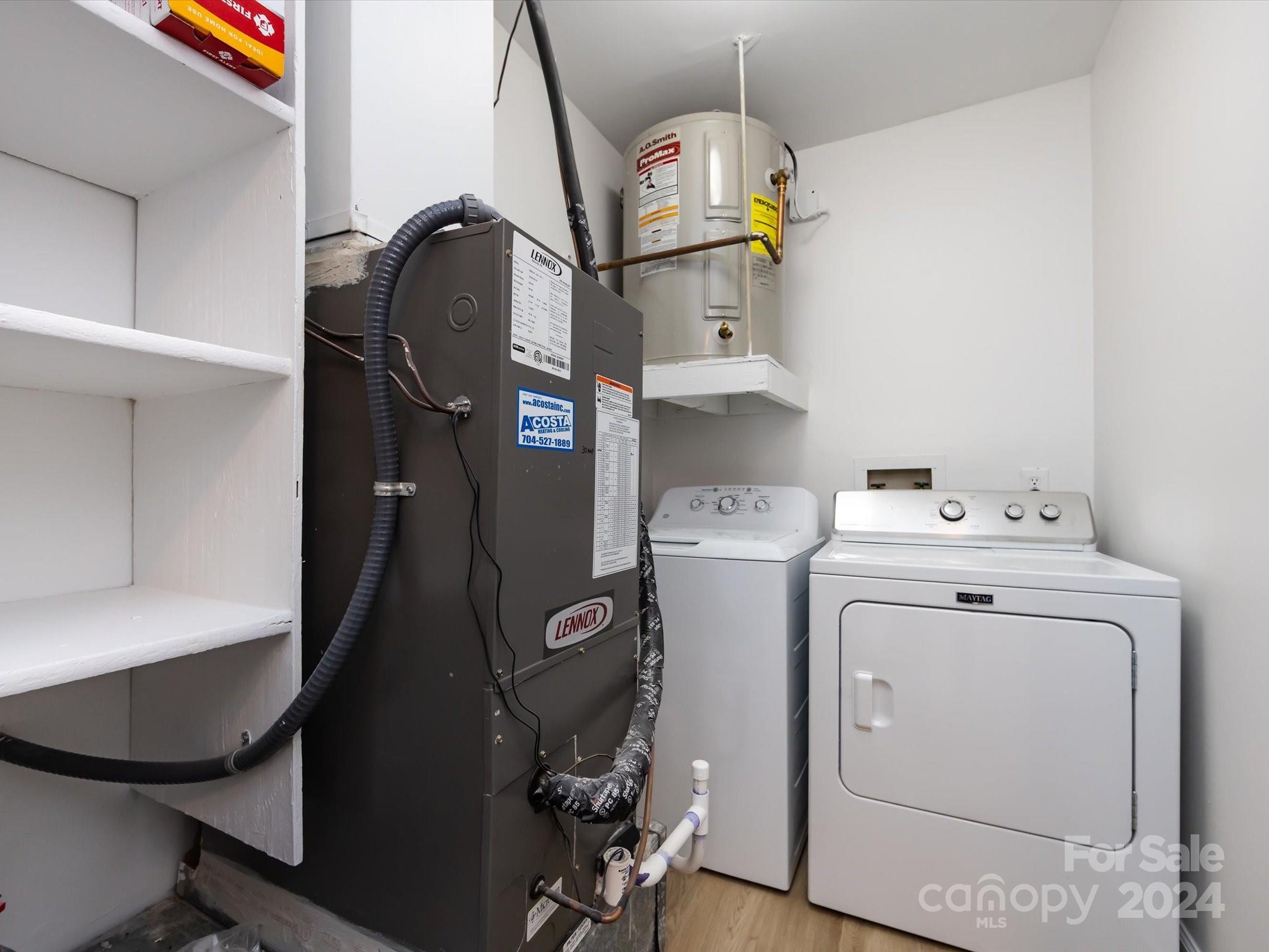 430 Queens Road, Unit 112 Charlotte, NC 28207 - Photo 17 of 19 a utility room with dryer and washer