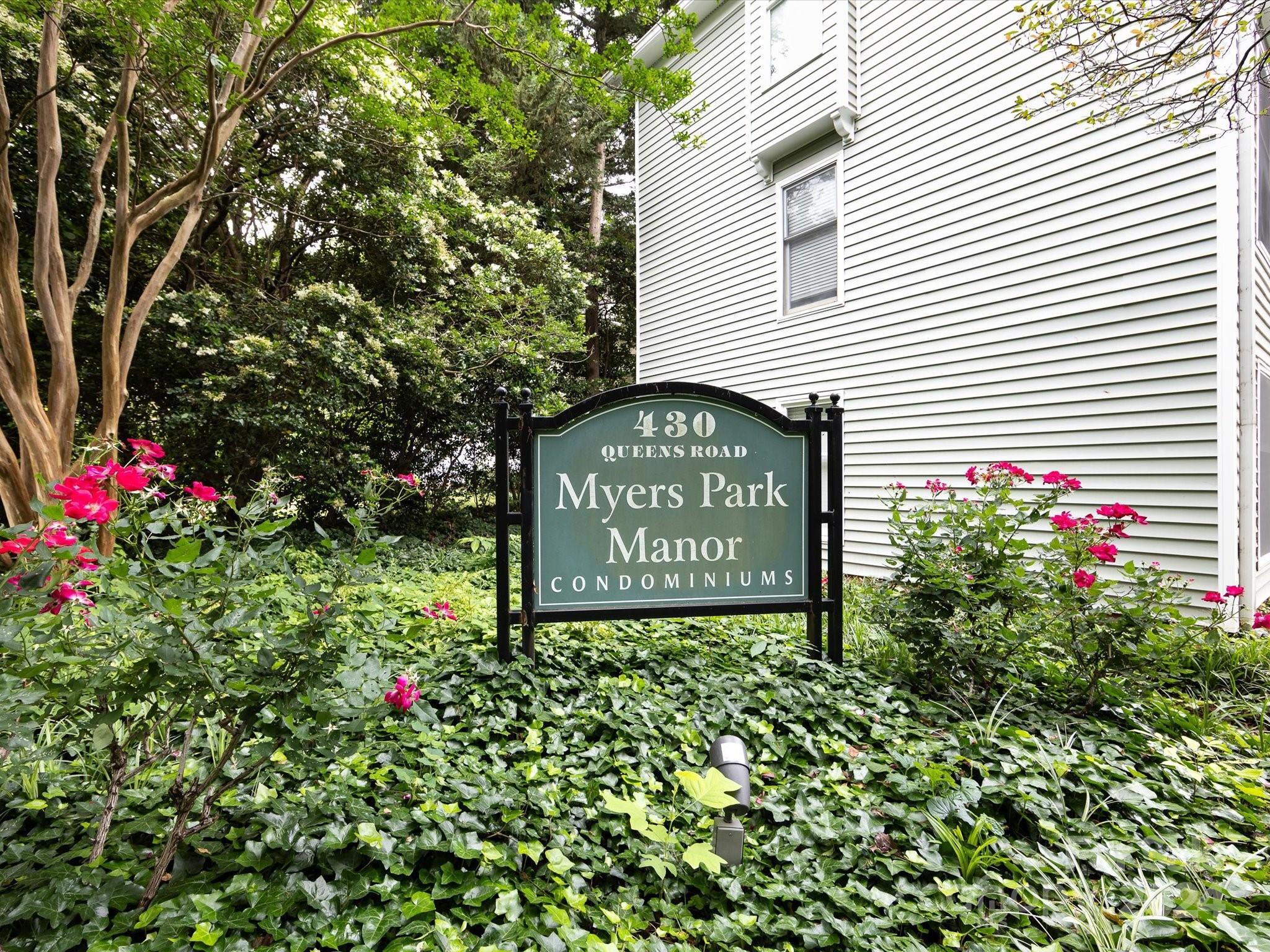 430 Queens Road, Unit 112 Charlotte, NC 28207 - Photo 2 of 19 a sign that is sitting in front of a house