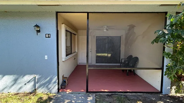 a room with furniture and a potted plant