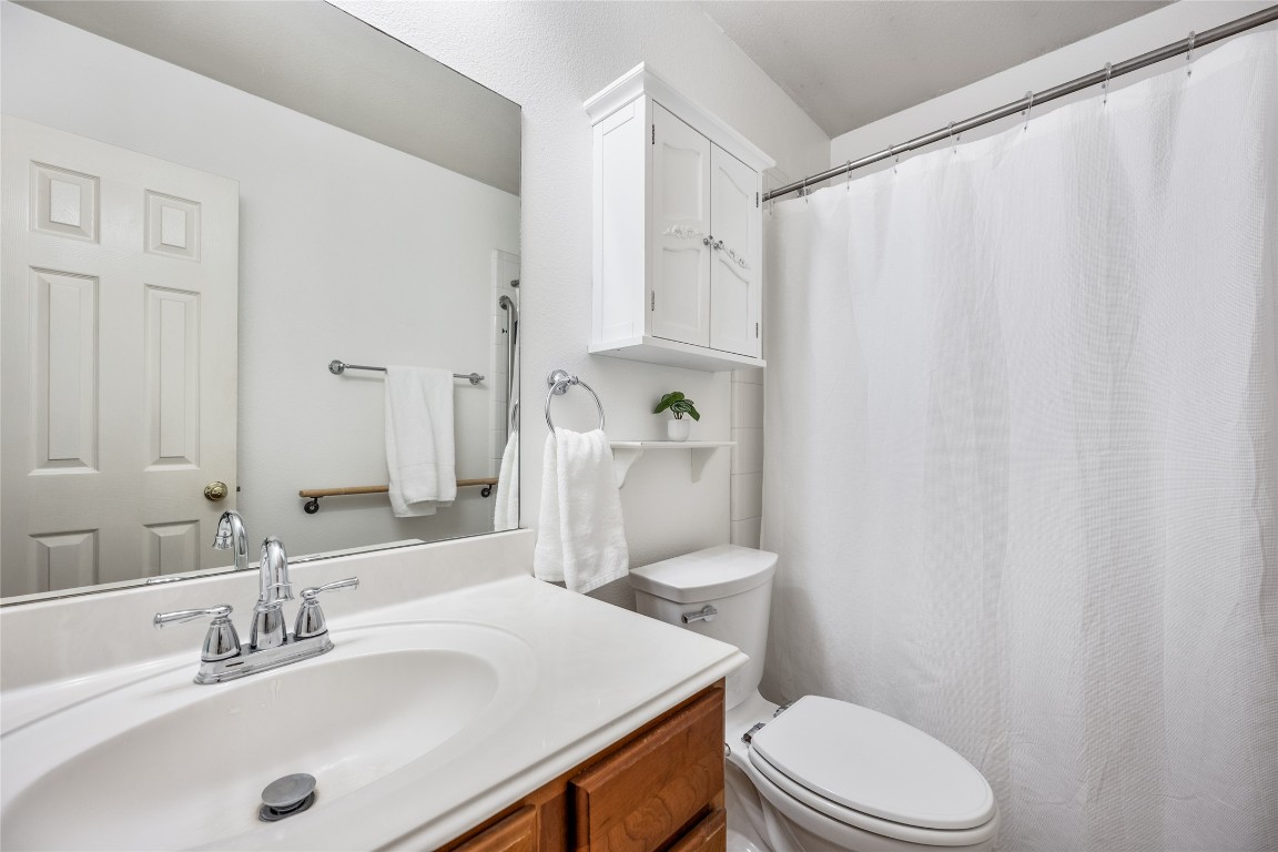 1564 Lorson Loop Round Rock, TX 78665 - Photo 17 of 27 Full bathroom featuring vanity and a shower with shower curtain