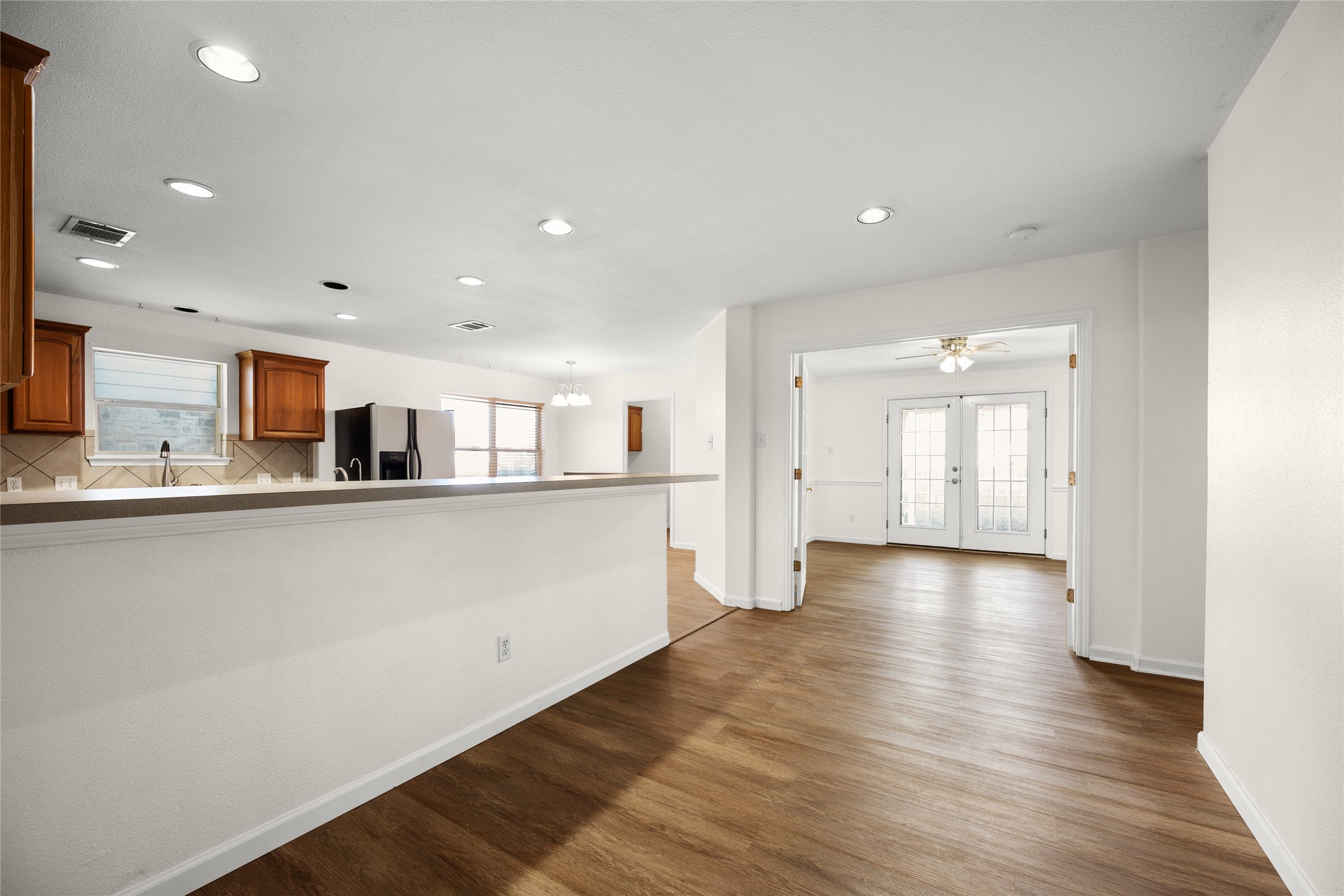 1564 Lorson Loop Round Rock, TX 78665 - Photo 6 of 27 a view of a kitchen with wooden floor and windows