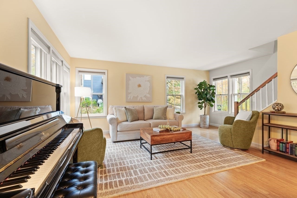 29d S Commons, Unit D Lincoln, MA 01773 - Photo 14 of 36 a living room with furniture and a flat screen tv