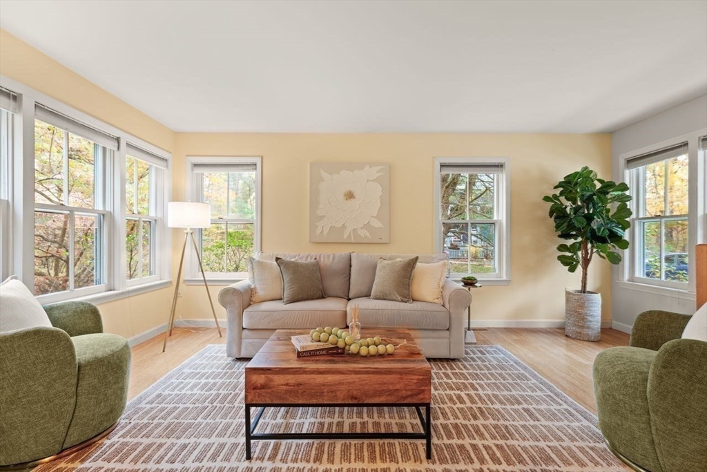 29d S Commons, Unit D Lincoln, MA 01773 - Photo 15 of 36 a living room with furniture and a large window
