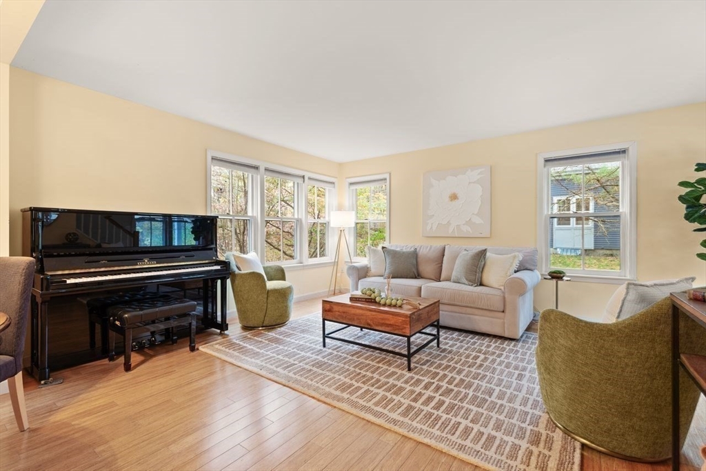 29d S Commons, Unit D Lincoln, MA 01773 - Photo 16 of 36 a living room with furniture and a flat screen tv