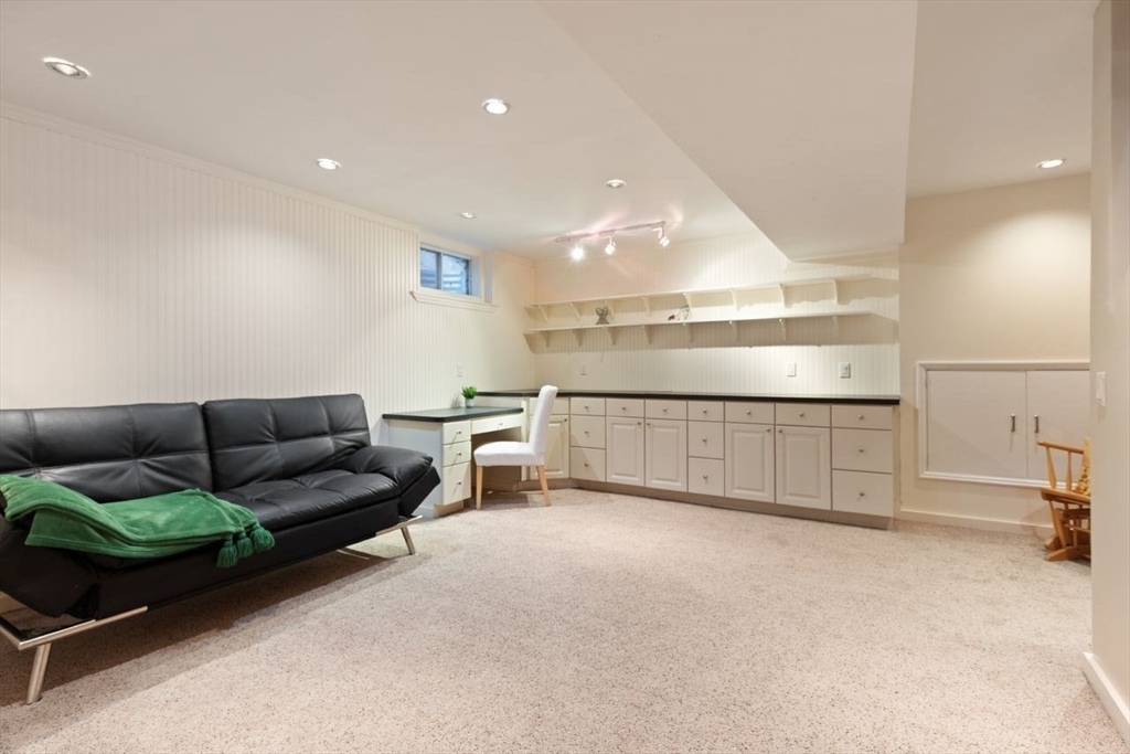 29d S Commons, Unit D Lincoln, MA 01773 - Photo 25 of 36 a living room with furniture and a table