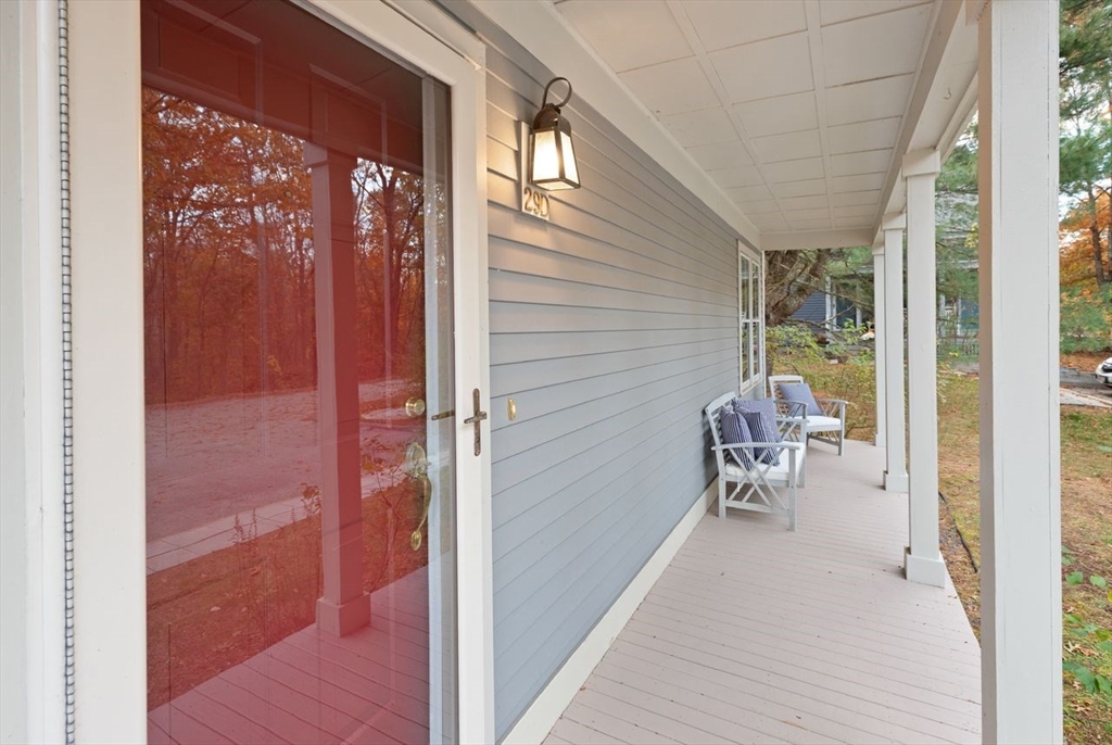 29d S Commons, Unit D Lincoln, MA 01773 - Photo 3 of 36 a balcony with chairs and table