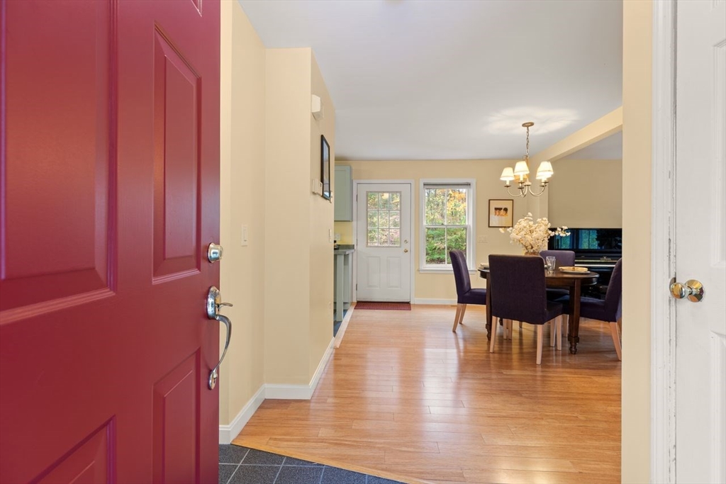 29d S Commons, Unit D Lincoln, MA 01773 - Photo 4 of 36 a view of a dining room with furniture and wooden floor