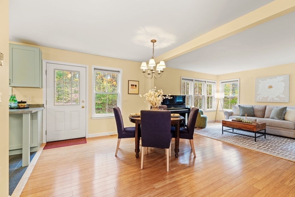 29d S Commons, Unit D Lincoln, MA 01773 - Photo 8 of 36 a view of a dining room with furniture window and wooden floor