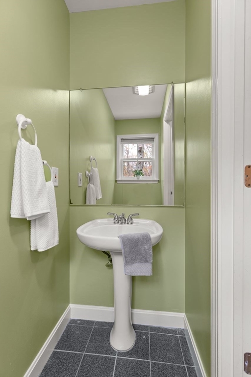 29d S Commons, Unit D Lincoln, MA 01773 - Photo 9 of 36 a bathroom with a sink and mirror