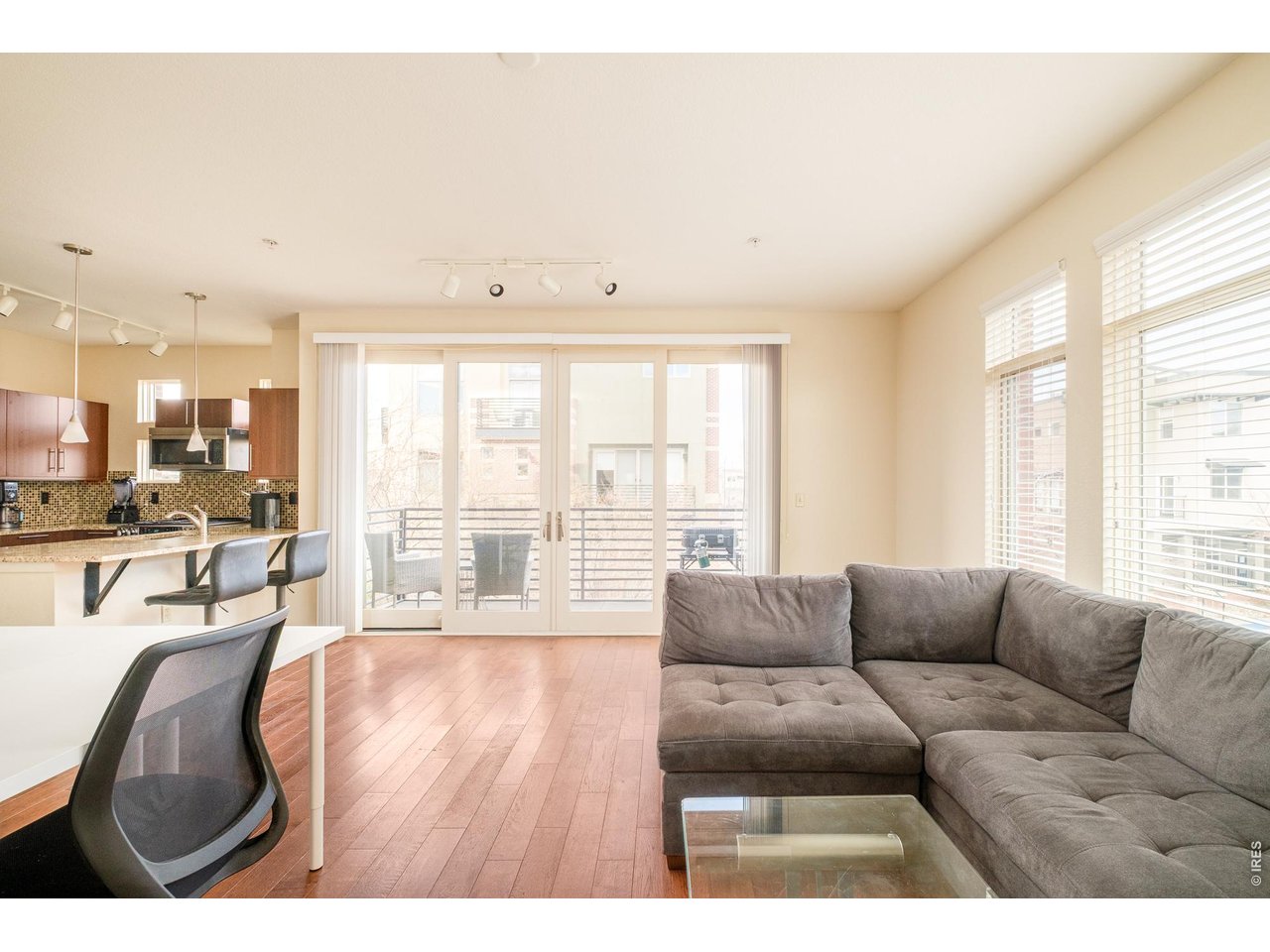 4555 13th Street, Unit 2A Boulder, CO 80304 - Photo 6 of 25 open living, dining & kitchen feel spacious, with light colors, lots of glass, & hardwood floors.