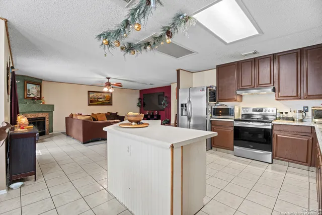 a kitchen with cabinets and stainless steel appliances