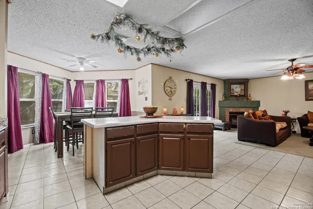 a kitchen with a cabinets and chandelier