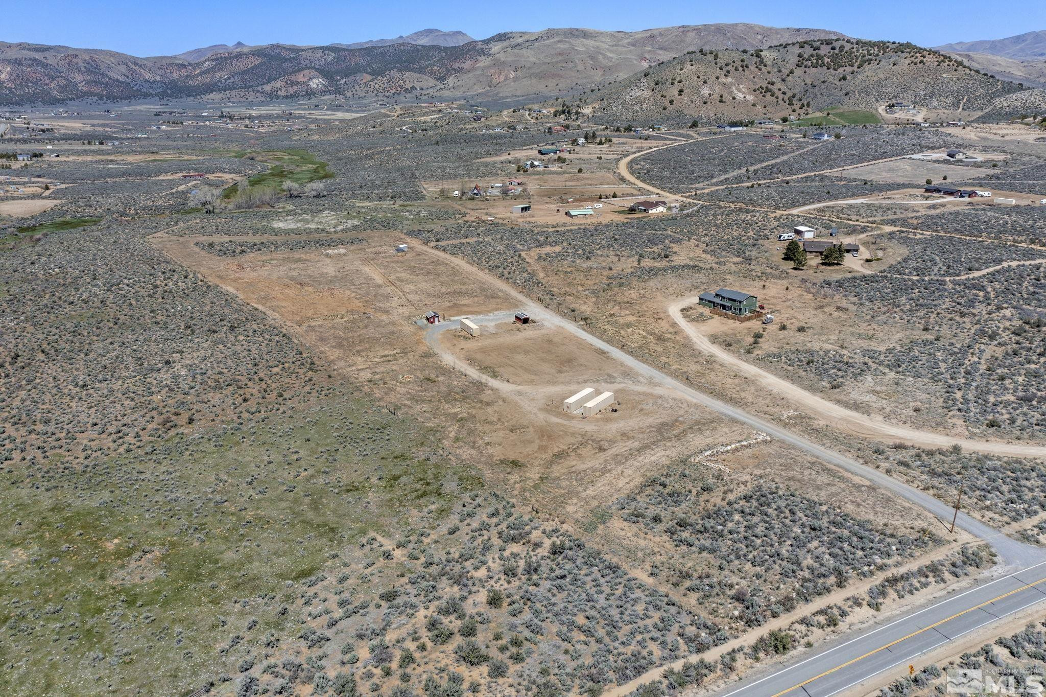 16100 North Red Rock Road Reno, NV 89508 - Photo 15 of 18 a view of a dry field with trees in the background