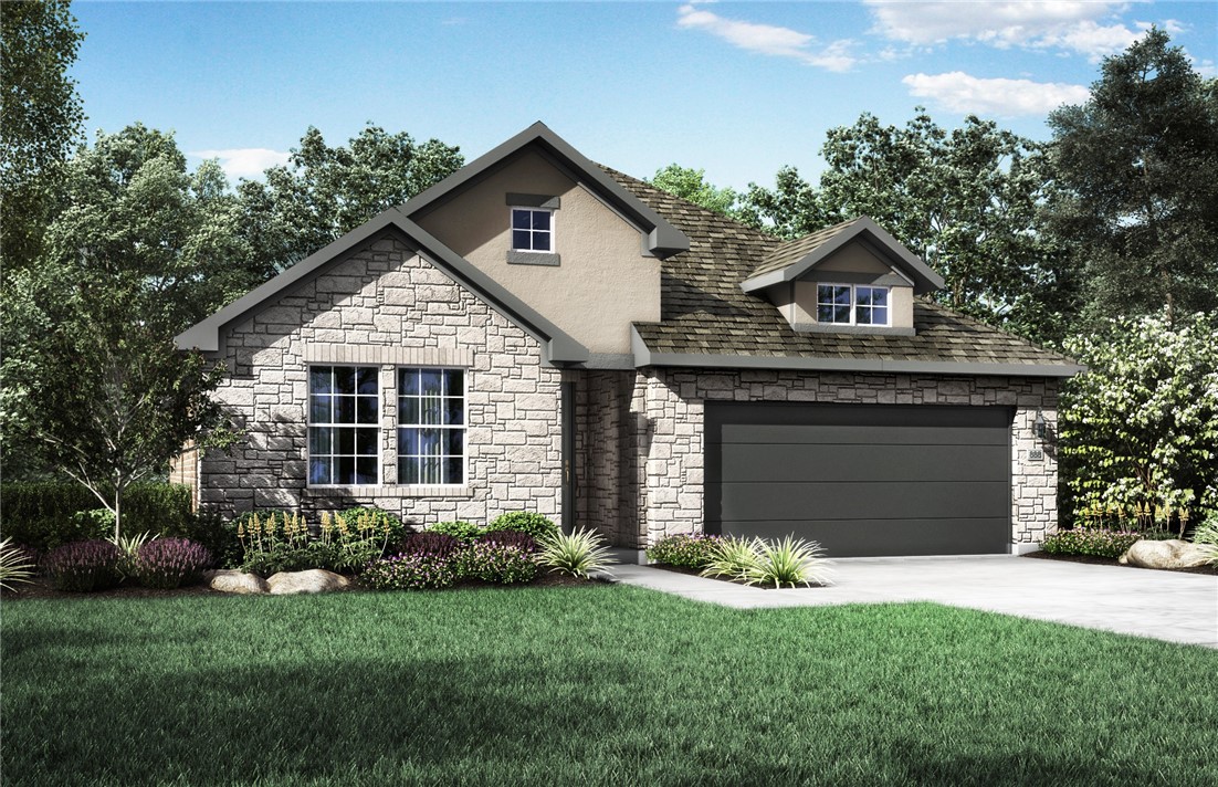 20904 Carries Ranch Road Pflugerville, TX 78660 - Photo 1 of 1 a front view of a house with a yard and garage