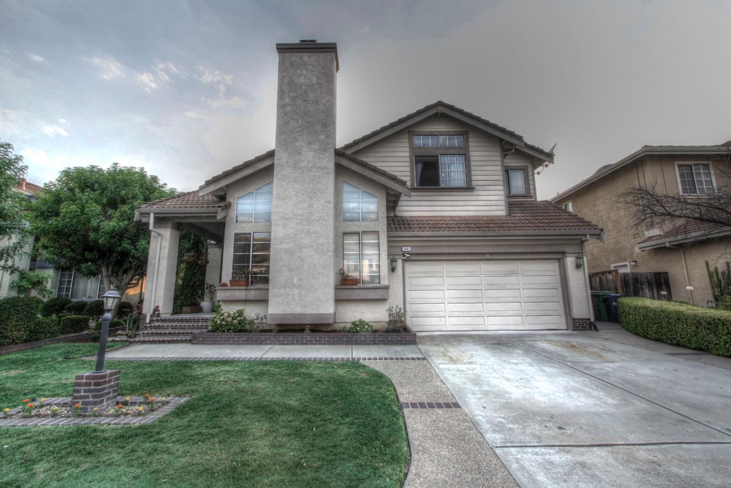 918 Boar Circle Fremont, CA 94539 - Photo 1 of 30 a front view of a house with a yard and garage