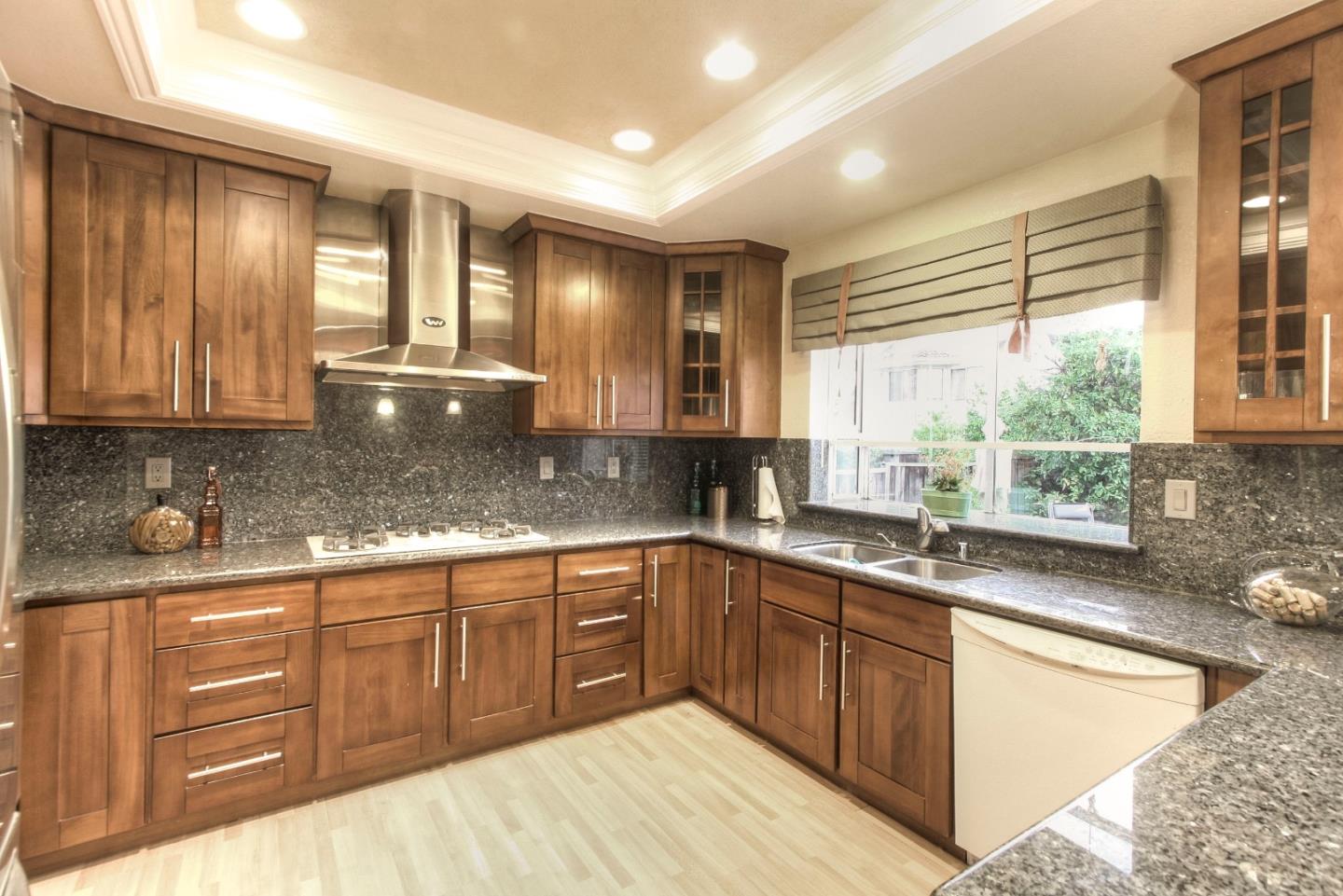 918 Boar Circle Fremont, CA 94539 - Photo 14 of 30 a large kitchen with granite countertop a sink and cabinets