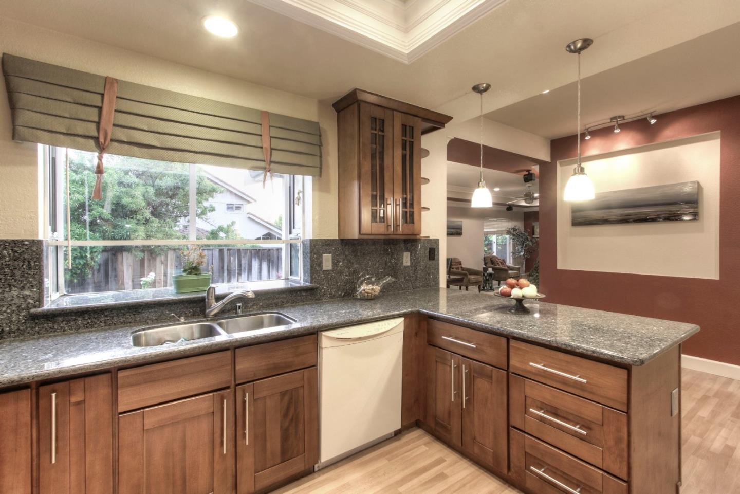 918 Boar Circle Fremont, CA 94539 - Photo 15 of 30 a kitchen with granite countertop a sink and white cabinets