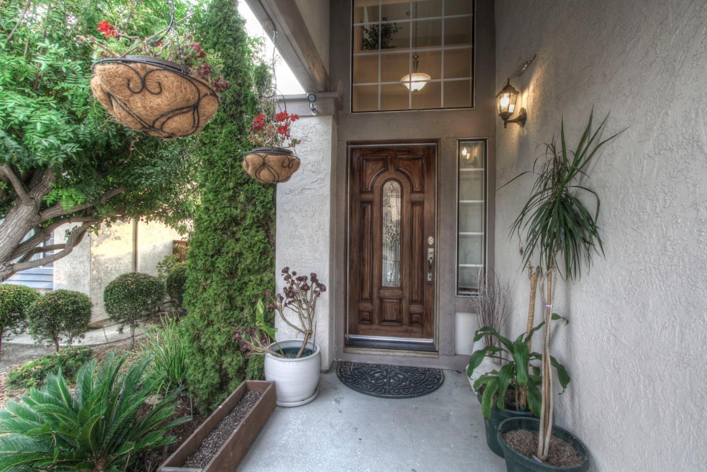 918 Boar Circle Fremont, CA 94539 - Photo 2 of 30 a potted plant sitting in front of a house