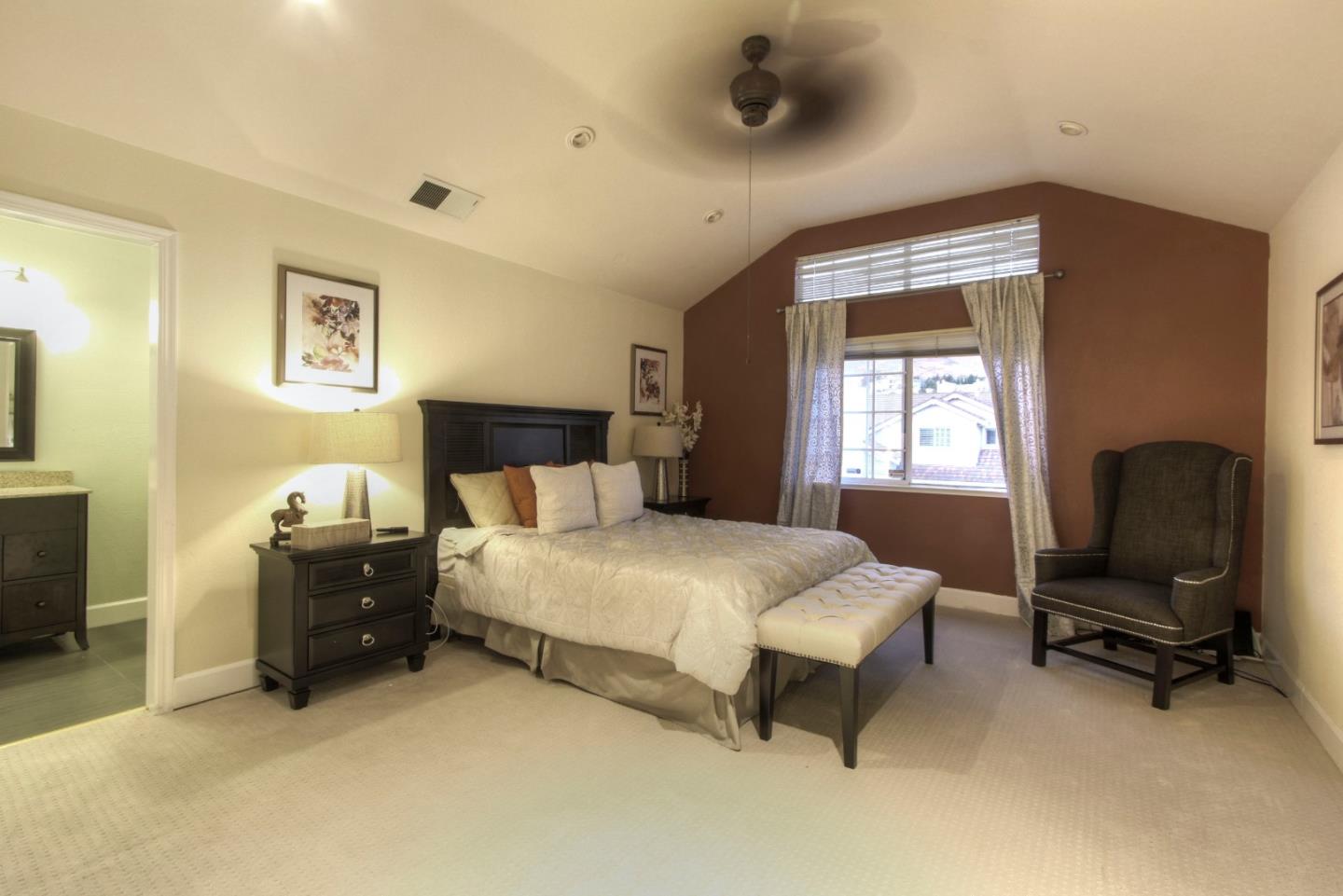 918 Boar Circle Fremont, CA 94539 - Photo 23 of 30 a bedroom with a bed and a chair