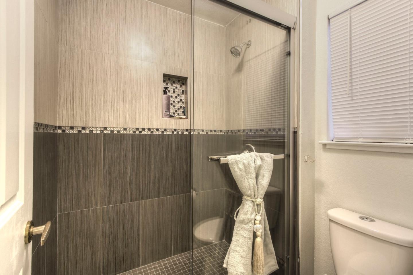 918 Boar Circle Fremont, CA 94539 - Photo 26 of 30 a bathroom with a shower and toilet