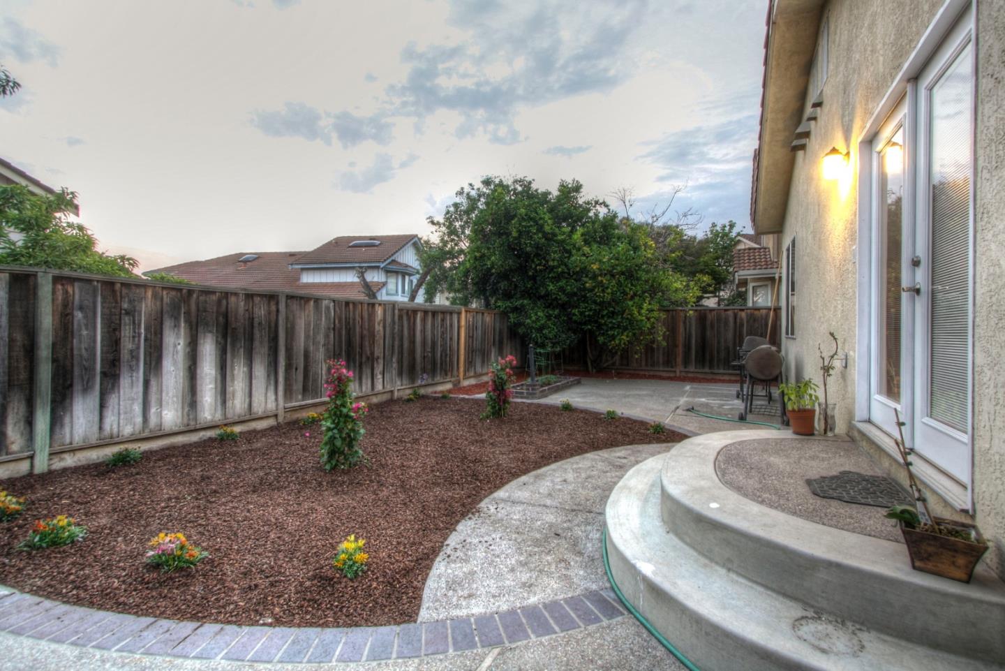 918 Boar Circle Fremont, CA 94539 - Photo 28 of 30 a backyard of a house with table and chairs