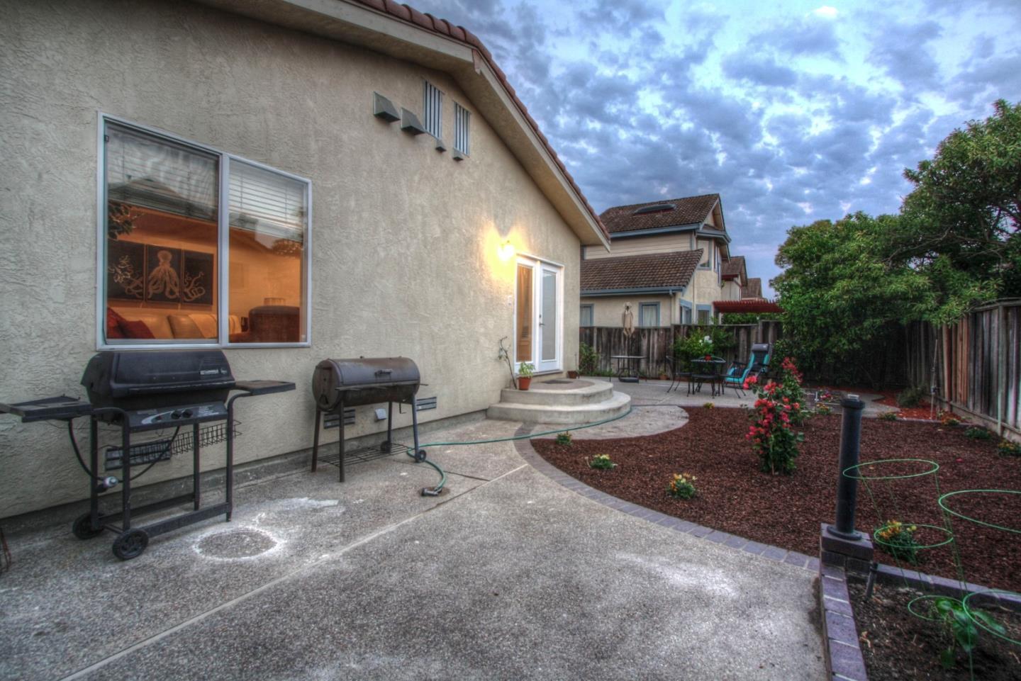 918 Boar Circle Fremont, CA 94539 - Photo 29 of 30 a backyard view of a house with basket ball table and chairs