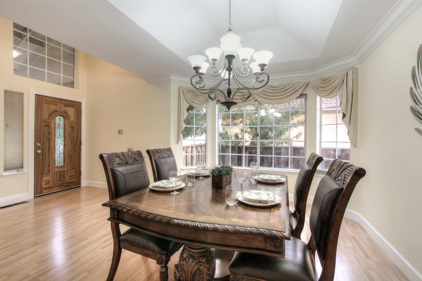 918 Boar Circle Fremont, CA 94539 - Photo 6 of 30 a view of a dining room with furniture wooden floor and chandelier