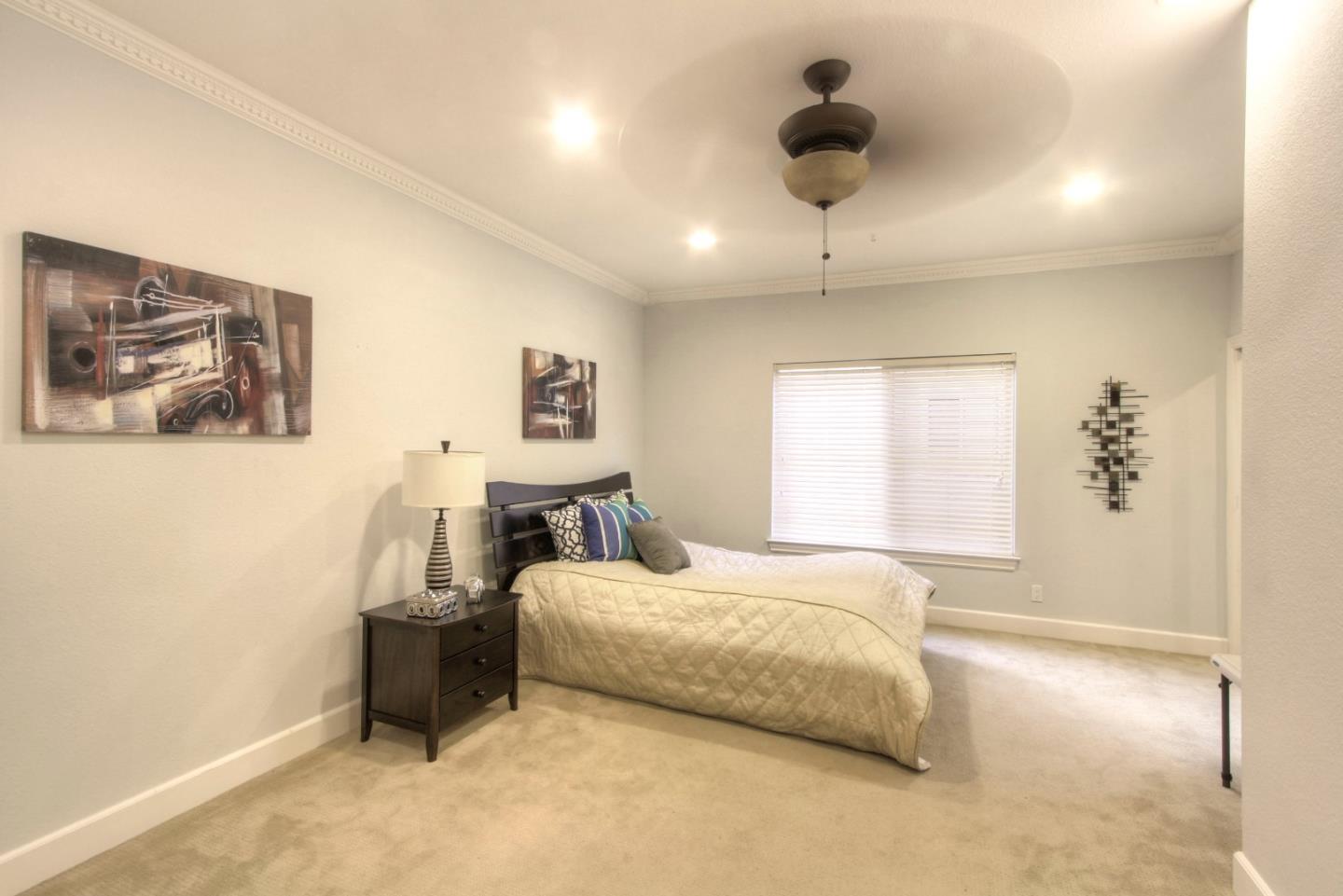 918 Boar Circle Fremont, CA 94539 - Photo 10 of 30 a bedroom with a bed and a painting on the wall