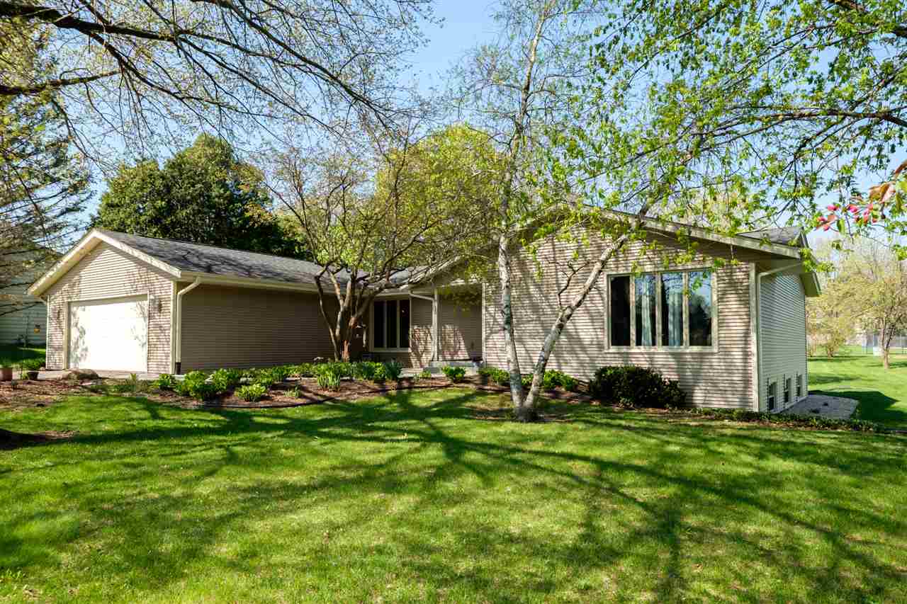 8211 Clockview Road Rockford, IL 61108 - Photo 1 of 25 a front view of house with yard and green space