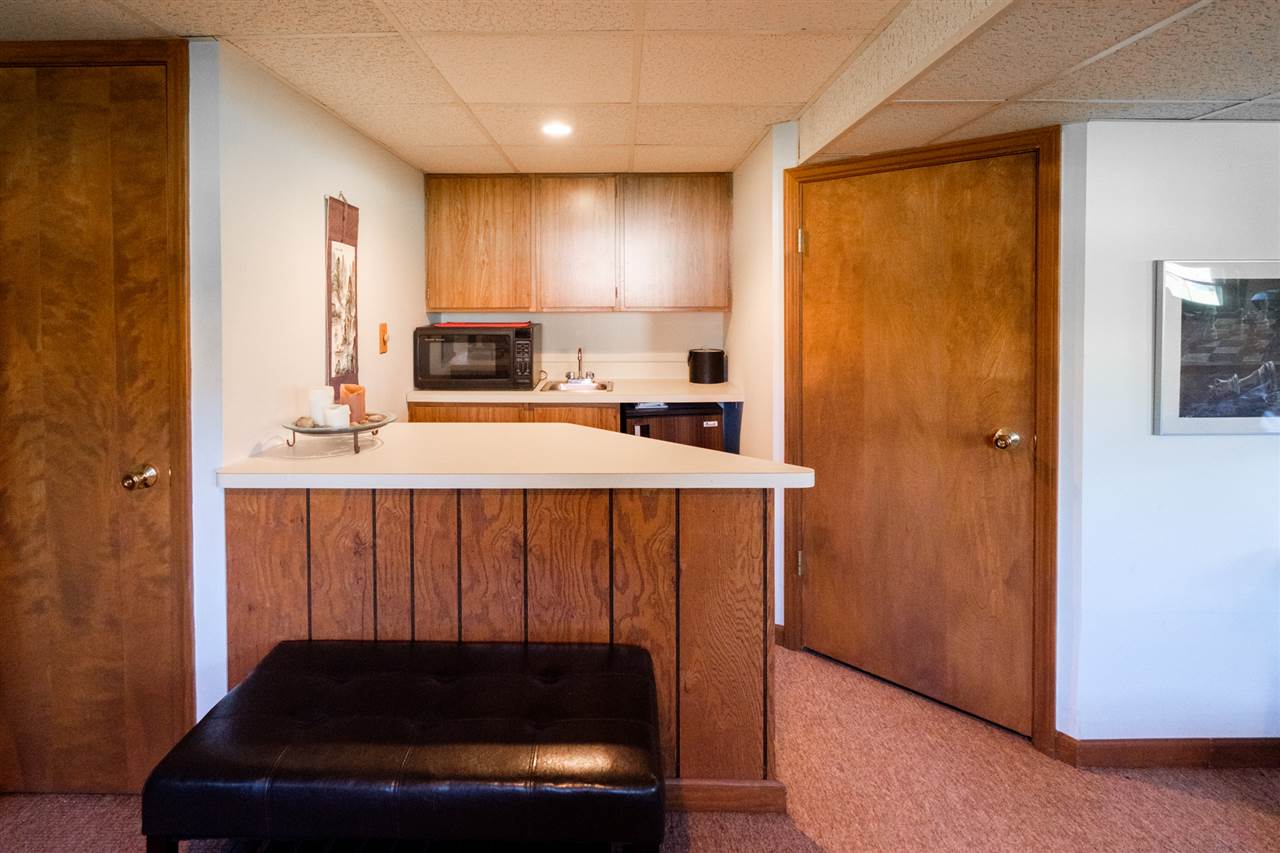 8211 Clockview Road Rockford, IL 61108 - Photo 18 of 25 a kitchen with a refrigerator and a stove