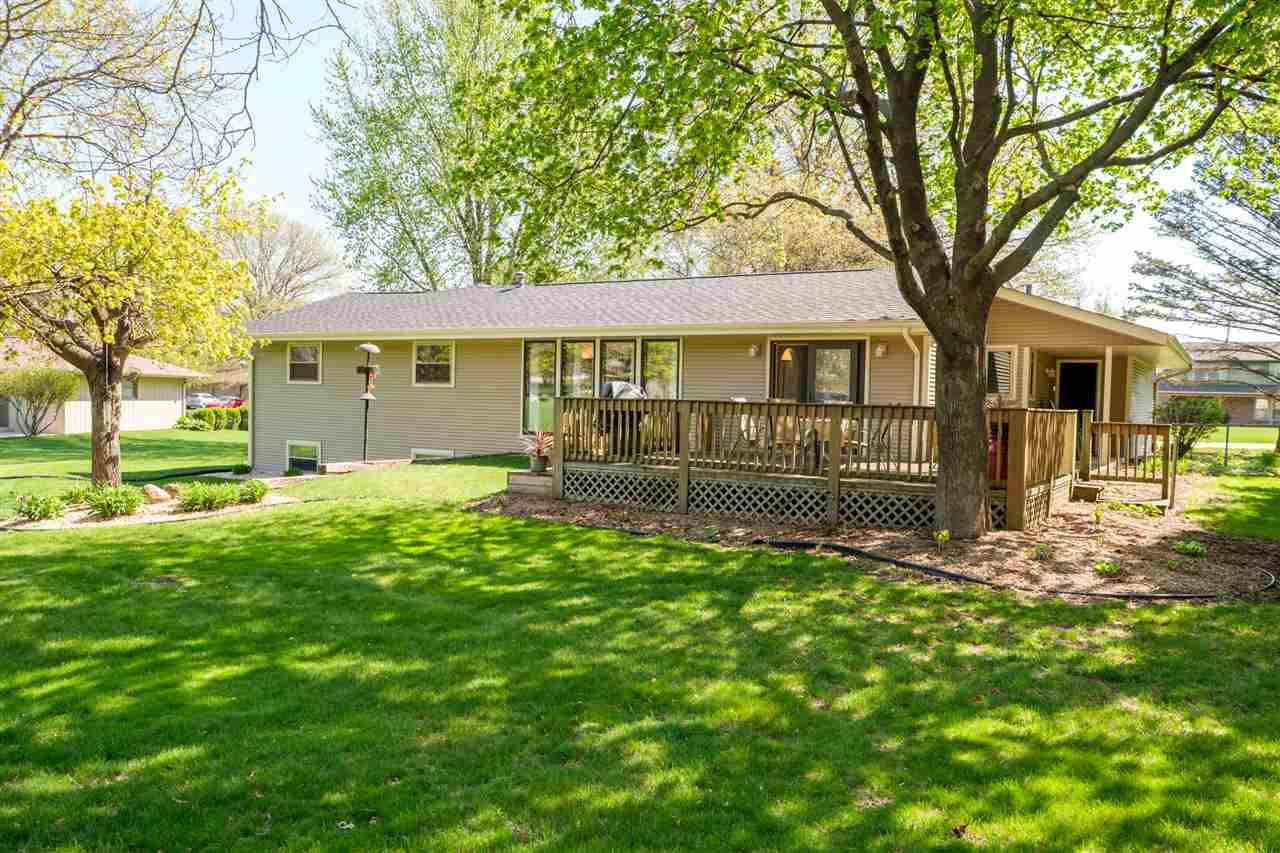 8211 Clockview Road Rockford, IL 61108 - Photo 21 of 25 a front view of a house with a garden