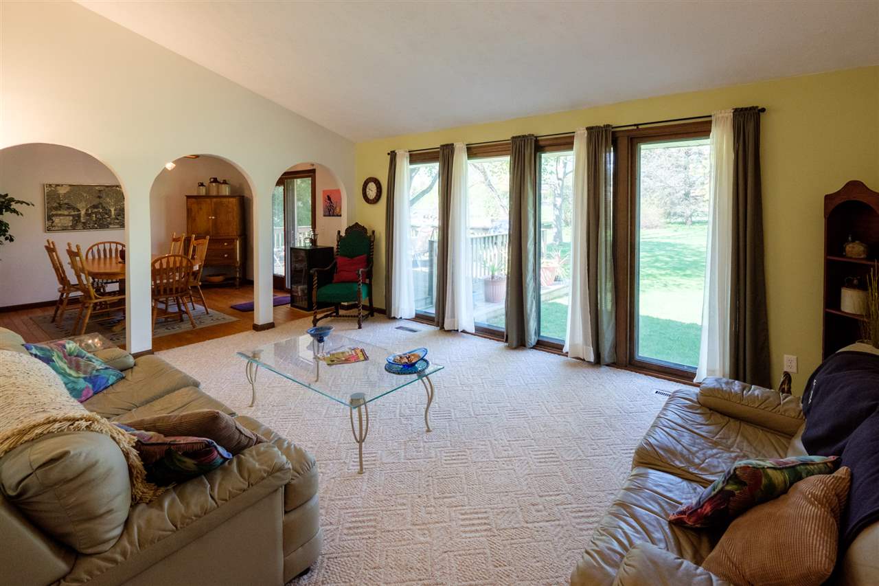 8211 Clockview Road Rockford, IL 61108 - Photo 8 of 25 a living room with furniture and a flat screen tv