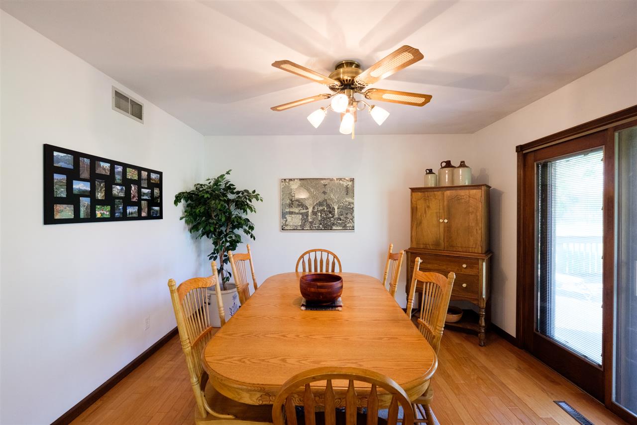 8211 Clockview Road Rockford, IL 61108 - Photo 10 of 25 a dining room with furniture and window