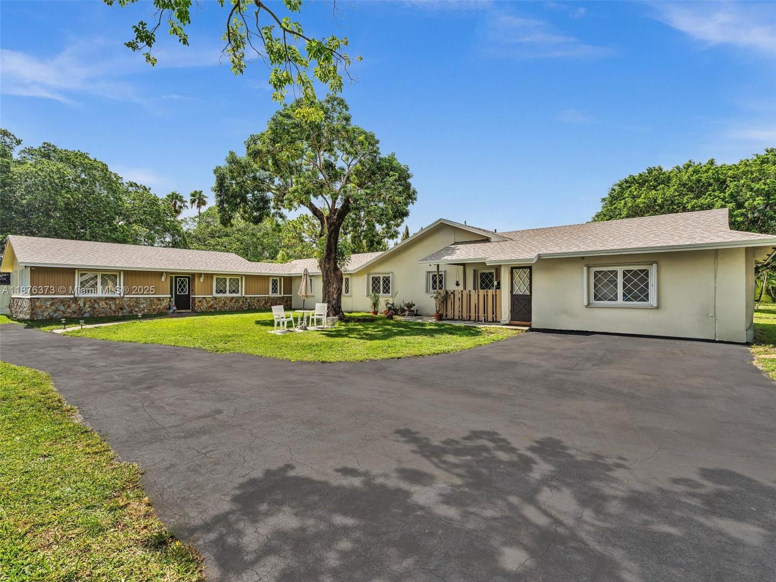 5310 Southwest 109th Avenue Davie, FL 33328 - Photo 67 of 89 Side of main house and front of the guest house.