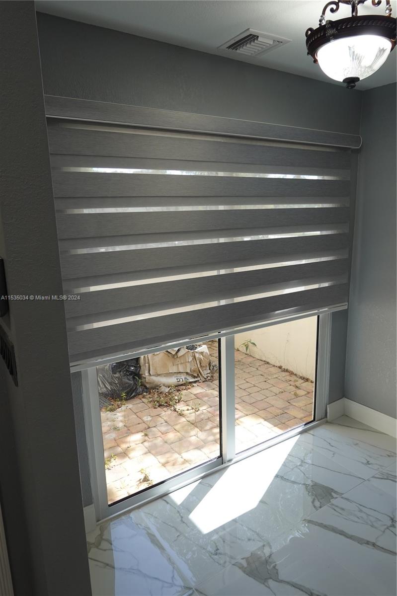 Townhouses at Jacaranda Condominiums Plantation, FL 33324 - Photo 14 of 50 a view of empty room with a window