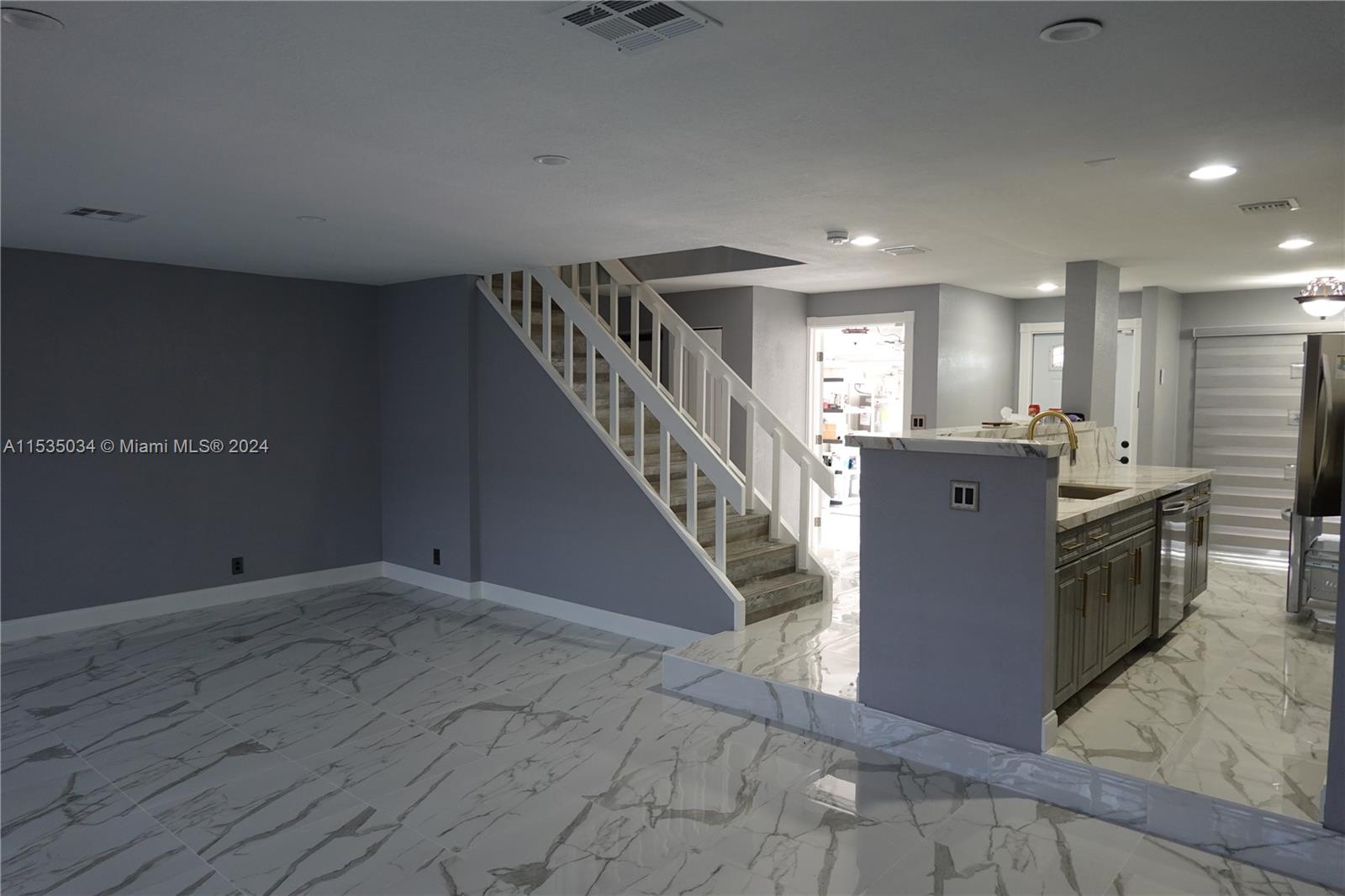 Townhouses at Jacaranda Condominiums Plantation, FL 33324 - Photo 20 of 50 a view of a kitchen with a sink